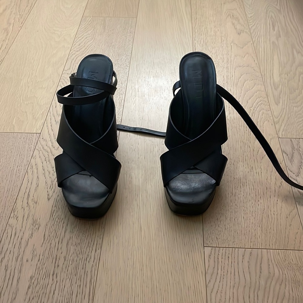 Black platform strappy heels.